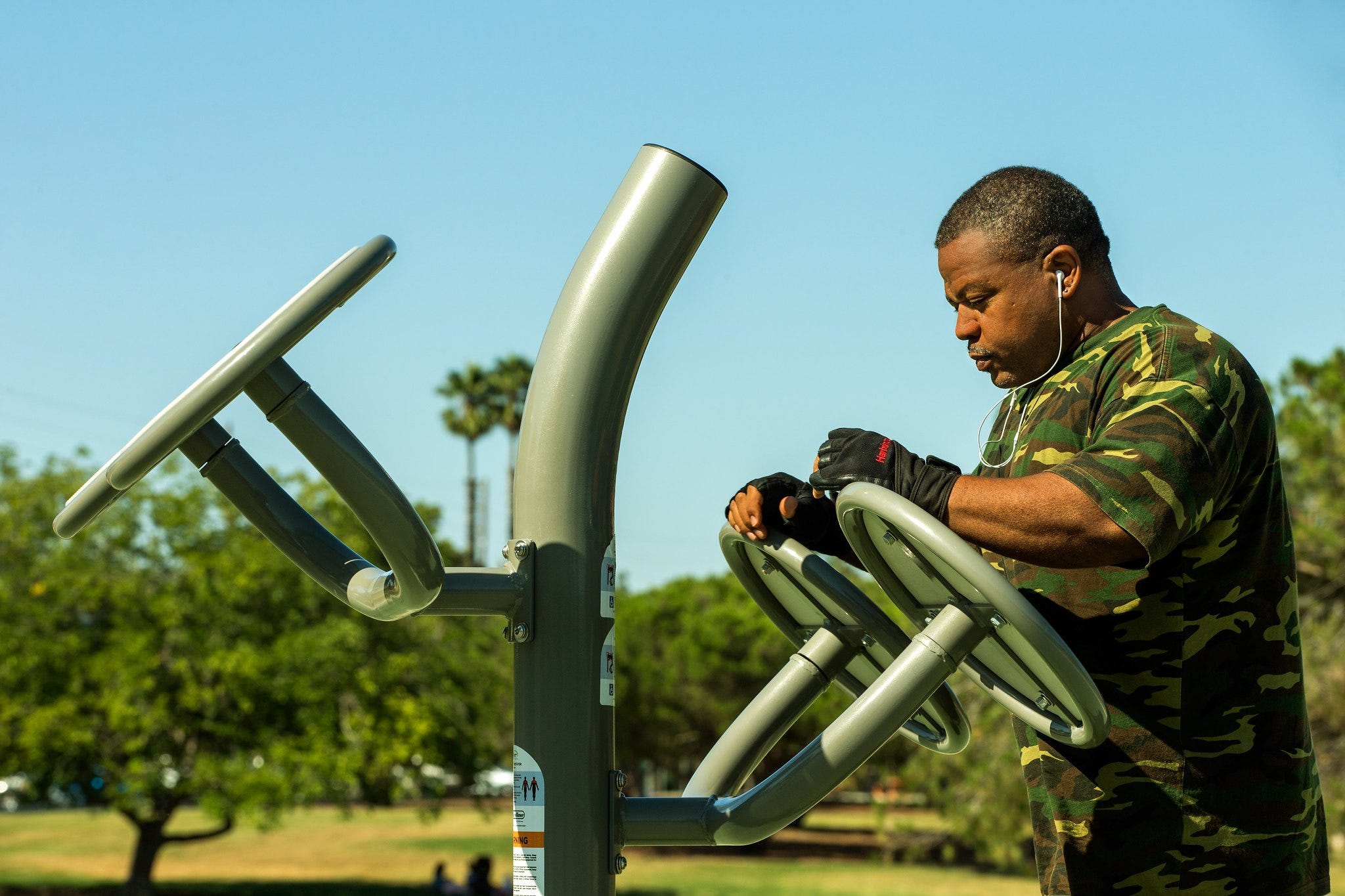 Man working out in a GameTime outdoor fitness park