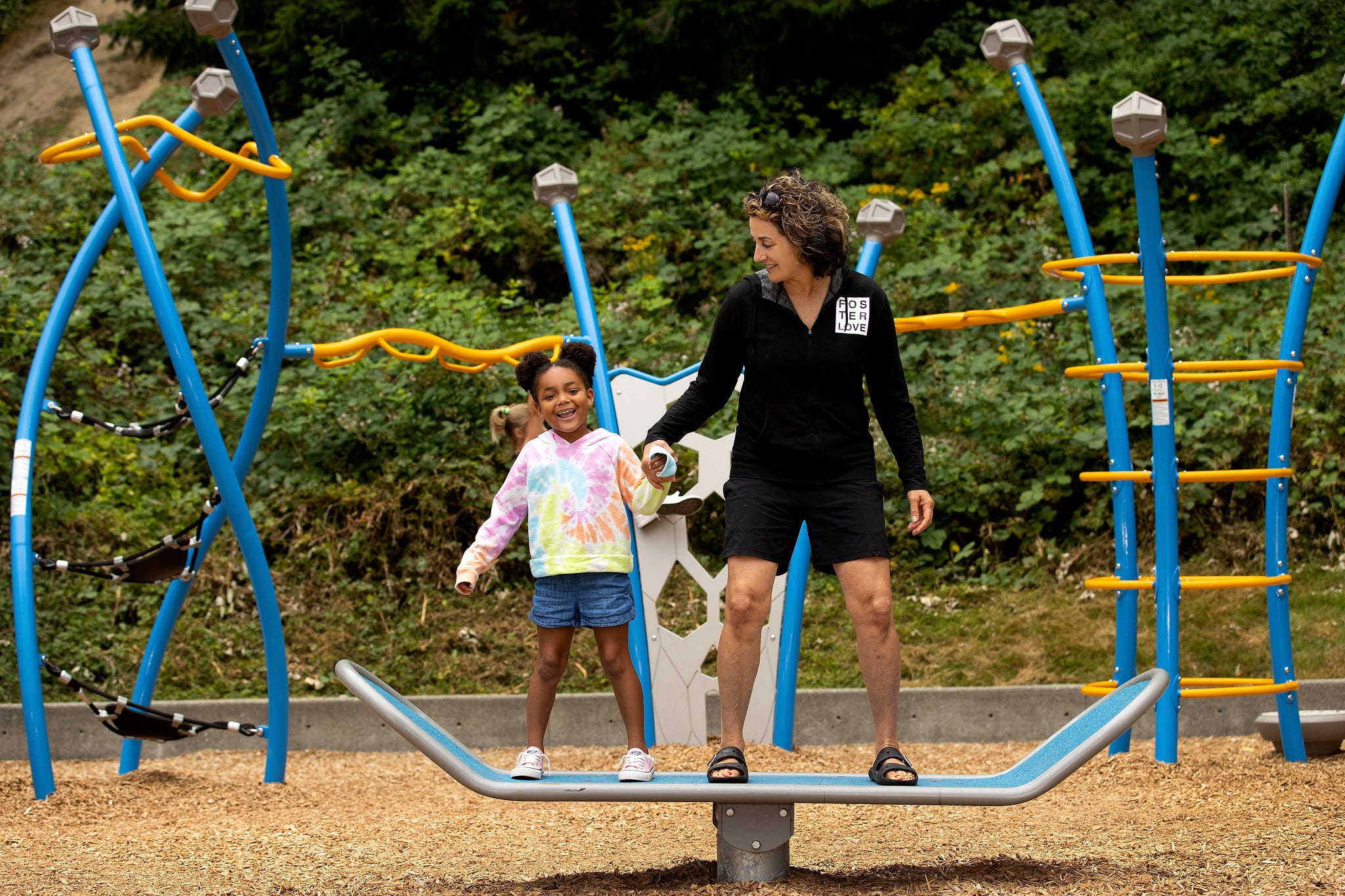 Mom and son play on the GameTime Surfboard