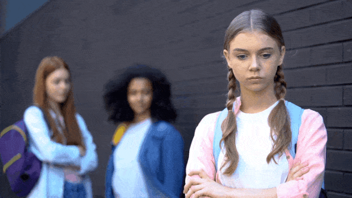 Girls at school bullying another girl
