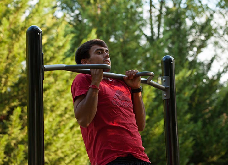 The Chin Up outdoor gym equipment helps increase muscular health.