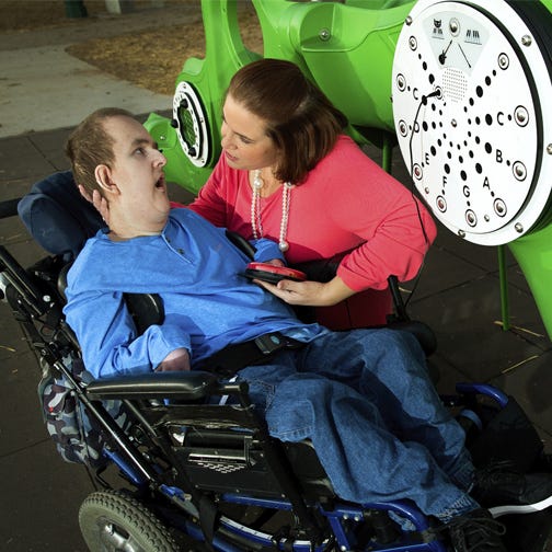Child in mobility device using an auditory sensor with the help of his mother