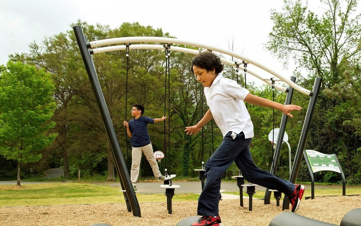 Challenge Course Youth by GameTime Children racing through obstacles