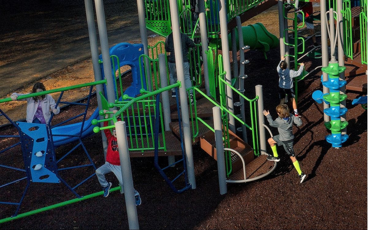 FitKid by GameTime Children playing on a blue and green play system