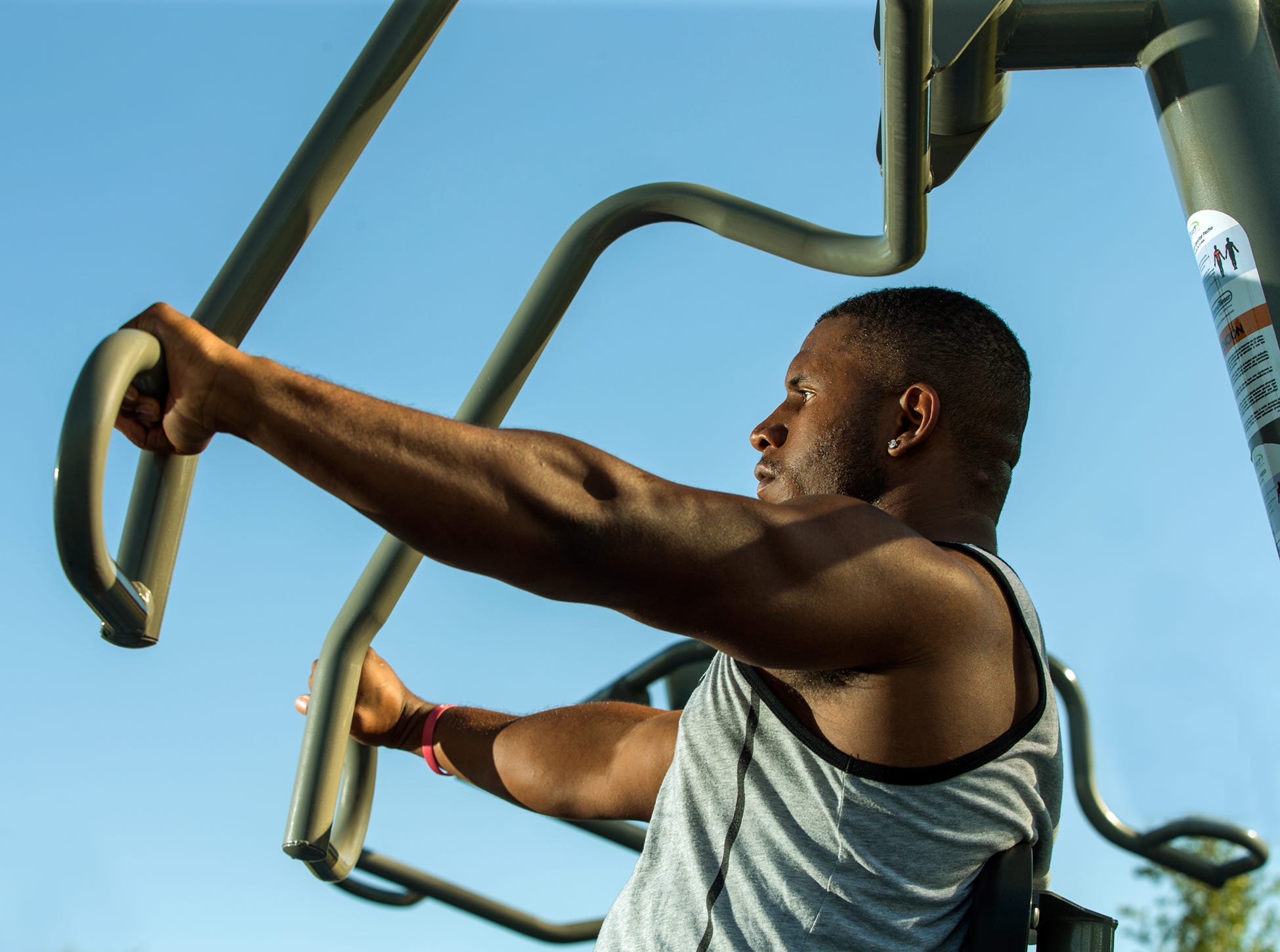 Chest Press by GameTime Man using chest press machine outdoors
