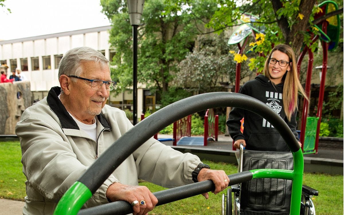 Therapeutic Outdoor Fitness Equipment Man using therapeutic outdoor fitness equipment