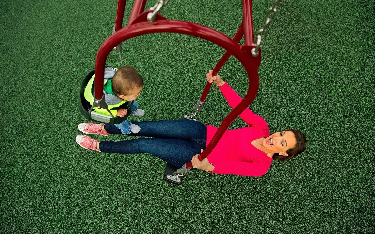 Expression Swing by GameTime Swing that features adult and child facing each other in two seats