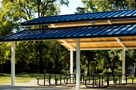 Park amenities including shade, seating, and site furnishings for outdoor recreation spaces