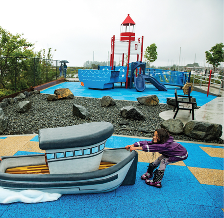 Custom playground with themed design and unique play features for a community space