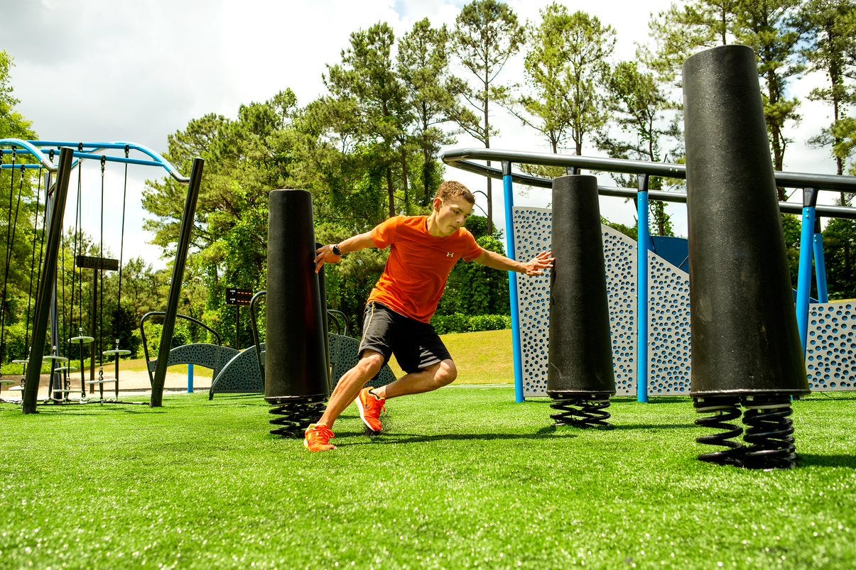 Child traversing through obstacle course